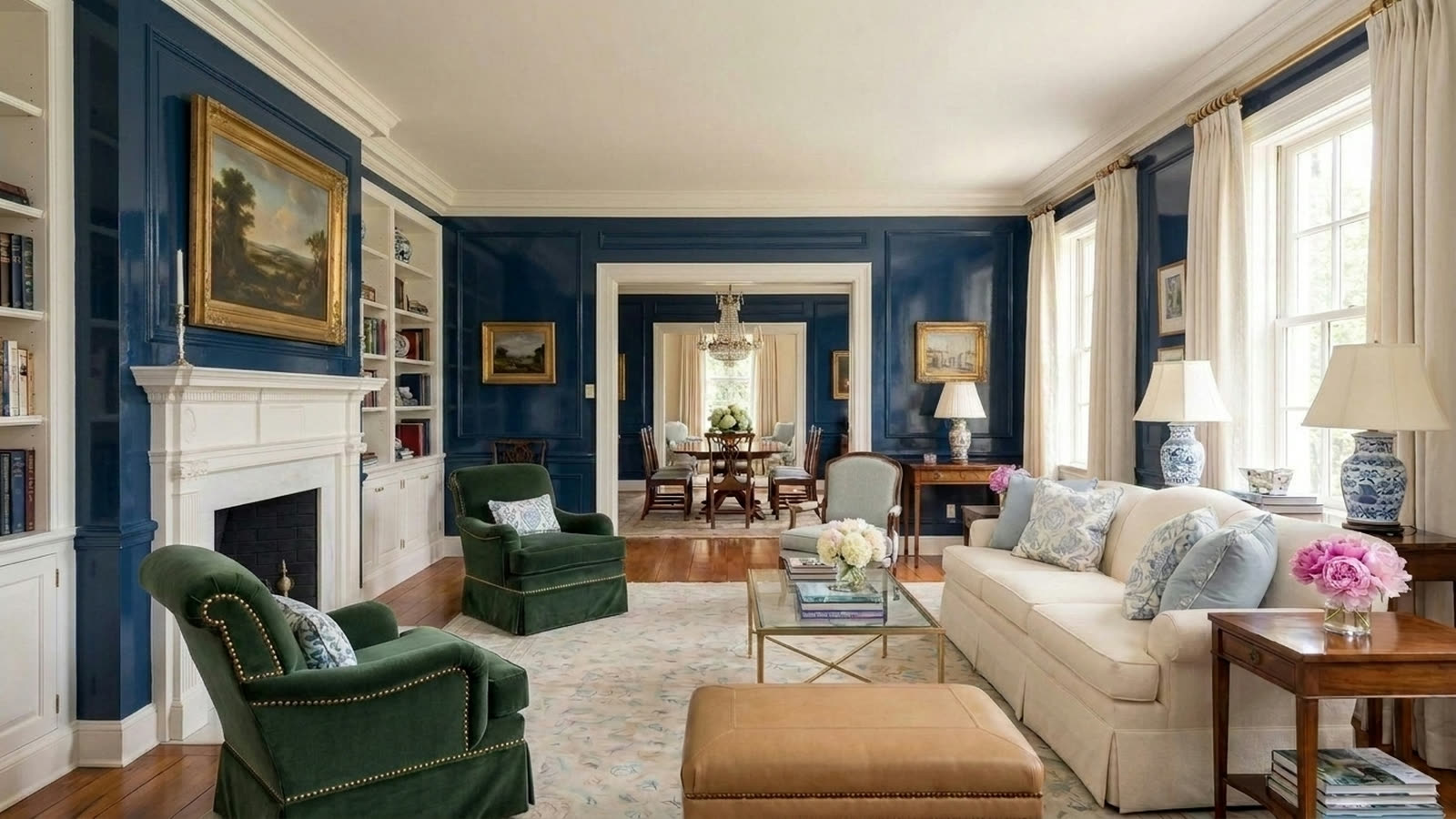 The same living room with the walls repainted in lacquered deep navy blue.