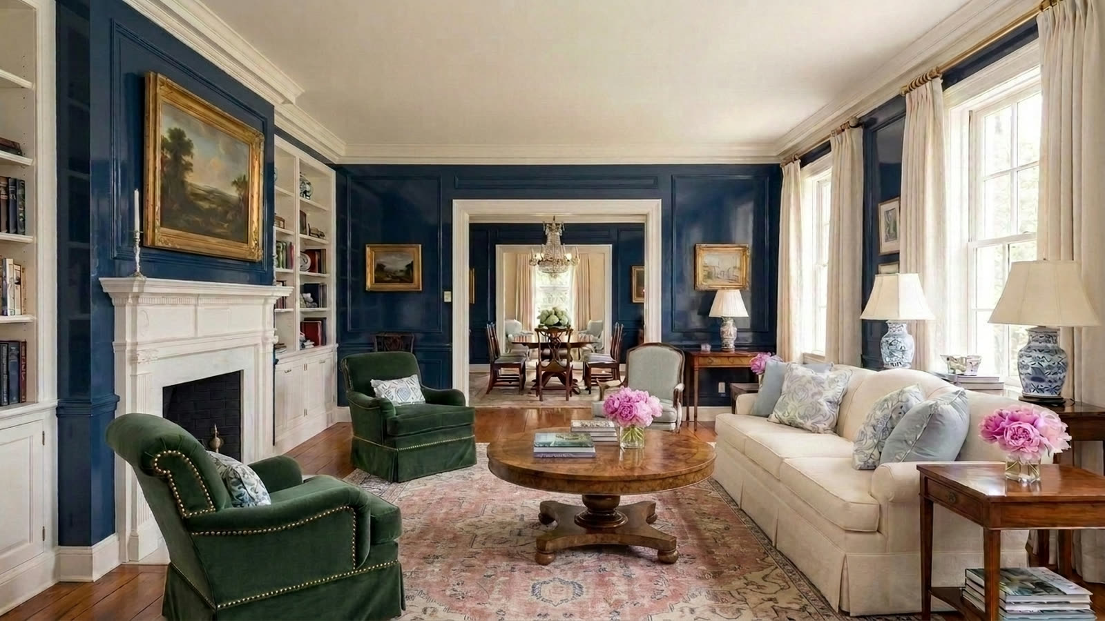 The same living room with a faded rose and indigo Oushak rug.